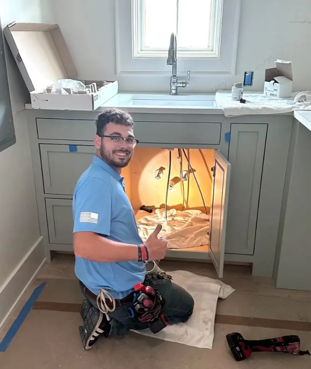 Plumber fixing clogged pipe in Florida
